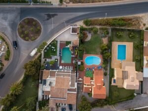 an aerial view of a house with a swimming pool